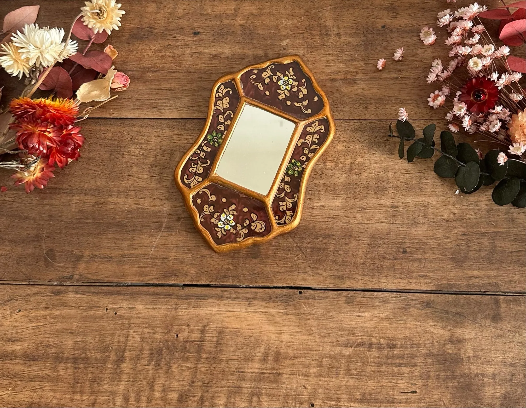 Miroir péruvien émaillé or et marron glacé
